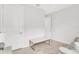 Minimalist room featuring tile floors, neutral-toned furniture and two large entry doors at 19652 Ship Wheel Way, Land O Lakes, FL 34638