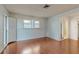 Spacious bedroom featuring hardwood floors, lots of light and ensuite bathroom at 2138 Viola Dr, Clearwater, FL 33764