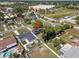 An aerial view showcases a home with solar panels with a spacious yard in a residential neighborhood at 2426 17Th N Ave, St Petersburg, FL 33713