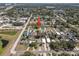 An aerial view of a neighborhood, with the subject property indicated by a red arrow in a residential area at 2426 17Th N Ave, St Petersburg, FL 33713