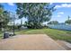 Spacious backyard with a basketball hoop and mature tree, offering a serene and recreational outdoor space at 2426 17Th N Ave, St Petersburg, FL 33713
