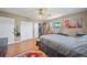 Comfortable bedroom with a window, ceiling fan, and closet space, perfect for relaxation and storage at 2426 17Th N Ave, St Petersburg, FL 33713