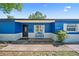 Well-maintained single-story house with blue exterior paint, and nicely landscaped front yard at 2426 17Th N Ave, St Petersburg, FL 33713