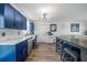 Bright kitchen features sleek countertops, farm sink, stainless appliances, stylish lighting, and counter seating at 2426 17Th N Ave, St Petersburg, FL 33713