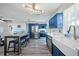 Open concept kitchen with stainless appliances, counter seating, and a farm sink at 2426 17Th N Ave, St Petersburg, FL 33713