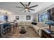 Comfortable living room features hardwood flooring, neutral paint, modern lighting, and large windows at 2426 17Th N Ave, St Petersburg, FL 33713