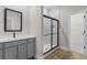 Modern bathroom featuring a glass enclosed shower, quartz countertop vanity and neutral color palette at 2426 Hiers Rd, Dover, FL 33527