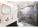 Elegant bathroom featuring a modern vanity and a luxurious walk-in shower with stylish tiling at 3072 Sugar Bear Trl, Palm Harbor, FL 34684