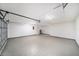 Spacious garage with ample lighting and epoxy floors for easy maintenance at 3072 Sugar Bear Trl, Palm Harbor, FL 34684