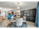 Cozy dining area with elegant lighting, stylish chairs, and seamless flow to living spaces at 3230 Bellericay Ln, Land O Lakes, FL 34638