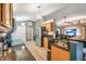 Well-lit kitchen with granite countertops and stainless steel appliances at 3230 Bellericay Ln, Land O Lakes, FL 34638