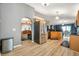 Bright kitchen featuring stainless steel appliances, wood cabinets, and wood laminate flooring at 3230 Bellericay Ln, Land O Lakes, FL 34638