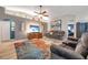 Comfortable living room with stylish furniture and a large television at 3230 Bellericay Ln, Land O Lakes, FL 34638