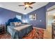 Spacious main bedroom with accent wall paint and well-placed bedside lighting at 3230 Bellericay Ln, Land O Lakes, FL 34638