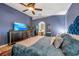 Relaxing main bedroom with modern furniture and an ensuite bathroom at 3230 Bellericay Ln, Land O Lakes, FL 34638