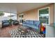 Inviting screened-in patio with comfortable seating, perfect for relaxation and outdoor enjoyment at 3230 Bellericay Ln, Land O Lakes, FL 34638
