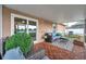 Comfortable screened patio with tile flooring, patio furniture, and backyard views, ideal for outdoor lounging and entertainment at 3230 Bellericay Ln, Land O Lakes, FL 34638