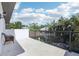 Spacious balcony with a view of a green backyard and a seating area at 3404 W Sevilla St, Tampa, FL 33629