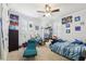 Bedroom featuring a lounge chair, twin bed, and personalized decor at 3404 W Sevilla St, Tampa, FL 33629