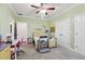 A colorful bedroom with cheerful decor, including a desk, dresser, and bed at 3404 W Sevilla St, Tampa, FL 33629