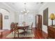 Dining room featuring hardwood floors, table and chairs, and natural light at 3404 W Sevilla St, Tampa, FL 33629