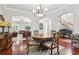 Dining room featuring hardwood floors, wood table, and chandelier lighting at 3404 W Sevilla St, Tampa, FL 33629