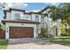 Stunning two-story home featuring a brick driveway and a beautiful arched entry at 3404 W Sevilla St, Tampa, FL 33629