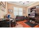 Well-appointed home office with hardwood floors, and a large desk for productivity at 3404 W Sevilla St, Tampa, FL 33629