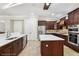 Modern kitchen with stainless appliances, island, and ample counter space at 3404 W Sevilla St, Tampa, FL 33629