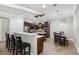 Open kitchen with stainless steel appliances, center island and tile flooring at 3404 W Sevilla St, Tampa, FL 33629