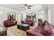 Open concept living room with tile floors and comfortable red leather sofas at 3404 W Sevilla St, Tampa, FL 33629