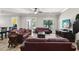 Cozy living room with comfortable leather furniture, large windows, and ample natural light at 3404 W Sevilla St, Tampa, FL 33629
