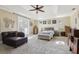 Spacious main bedroom with tray ceiling, sitting area, and plush carpeting at 3404 W Sevilla St, Tampa, FL 33629