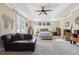 Spacious main bedroom with a tray ceiling, French doors, and a comfortable seating area at 3404 W Sevilla St, Tampa, FL 33629