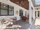 Covered patio with tile flooring, ceiling fans, and outdoor seating creates a relaxing space at 3404 W Sevilla St, Tampa, FL 33629