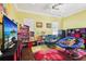 Spacious playroom featuring comfortable seating, a large TV, and colorful decor, perfect for  at 3404 W Sevilla St, Tampa, FL 33629