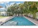 Rectangular swimming pool and hot tub surrounded by palm trees and brick pavers at 3404 W Sevilla St, Tampa, FL 33629