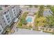 Apartment community featuring a neighborhood pool with private covered patio and landscaping at 350 2Nd N St # 1, St Petersburg, FL 33701