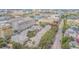 Aerial view showcasing multiple townhomes with private garages, trees along the street, and the community's serene ambiance at 350 2Nd N St # 1, St Petersburg, FL 33701