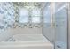 Bathroom with a large tub and glass enclosed shower at 350 2Nd N St # 1, St Petersburg, FL 33701
