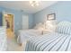 Comfortable bedroom with two twin beds, soft blue walls, and doorway leading to other rooms at 350 2Nd N St # 1, St Petersburg, FL 33701
