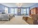 Spacious bedroom with ample natural light, a ceiling fan, and neutral carpeting at 350 2Nd N St # 1, St Petersburg, FL 33701