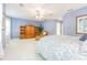 Large bedroom with neutral walls, carpeting, and ceiling fan at 350 2Nd N St # 1, St Petersburg, FL 33701