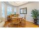Bright dining area with hardwood floors, a round table, and natural light at 350 2Nd N St # 1, St Petersburg, FL 33701