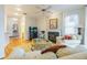 Cozy living room showcasing hardwood floors, fireplace, and neutral decor at 350 2Nd N St # 1, St Petersburg, FL 33701