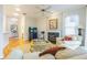 Bright living room featuring a fireplace, hardwood floors, and comfortable seating at 350 2Nd N St # 1, St Petersburg, FL 33701