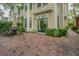 Lovely brick patio with wrought iron table and chairs surrounded by manicured greenery at 350 2Nd N St # 1, St Petersburg, FL 33701
