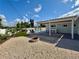 Inviting backyard featuring a pool, fire pit, and outdoor seating under a covered patio at 3701 Manatee Se Dr, St Petersburg, FL 33705