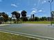 Outdoor basketball court with hoop, surrounded by greenery and a clear blue sky, perfect for sports at 3701 Manatee Se Dr, St Petersburg, FL 33705