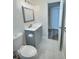 Updated bathroom with modern fixtures, vanity, and tile flooring, offering a clean and functional space at 3701 Manatee Se Dr, St Petersburg, FL 33705